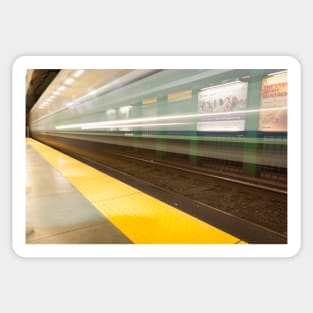 Platform with yellow line railway tracks blurred in motion blur aws train passes. Sticker